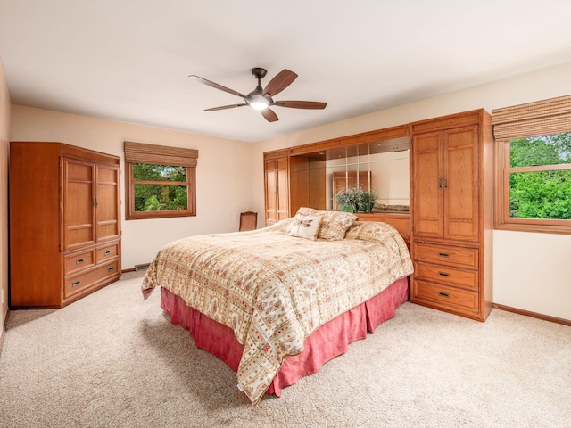 4159 Rowanne Rd, Columbus, OH 43214 - bedroom with multiple windows, light carpet, and baseboards