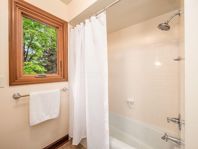 4159 Rowanne Rd, Columbus, OH 43214 - bathroom with shower / tub combo and baseboards