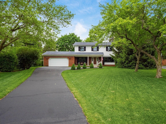 4159 Rowanne Rd, Columbus, OH 43214 - traditional-style home featuring an attached garage, a front lawn, and covered porch
