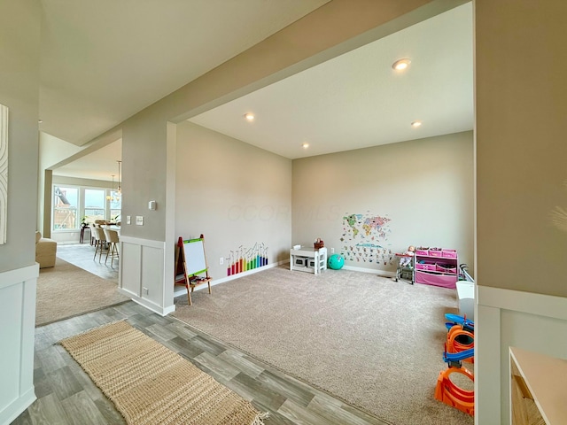 recreation room with recessed lighting and wood finished floors