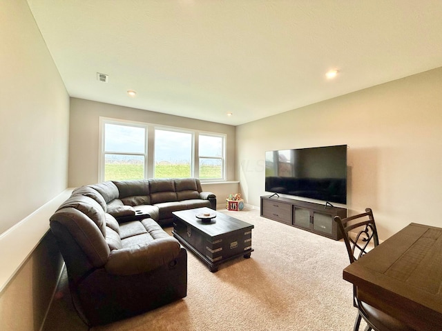 carpeted living room featuring recessed lighting and visible vents