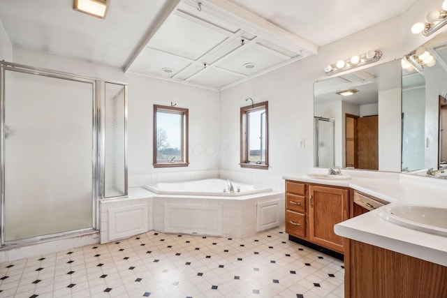bathroom with a bath, a sink, double vanity, coffered ceiling, and a shower stall