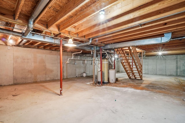 unfinished below grade area featuring stairs