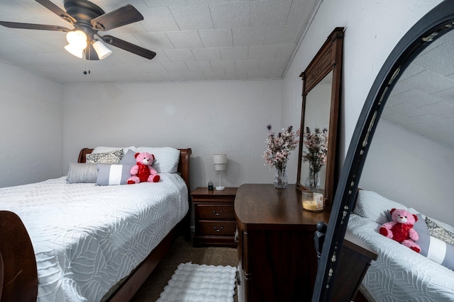 bedroom with dark carpet and ceiling fan