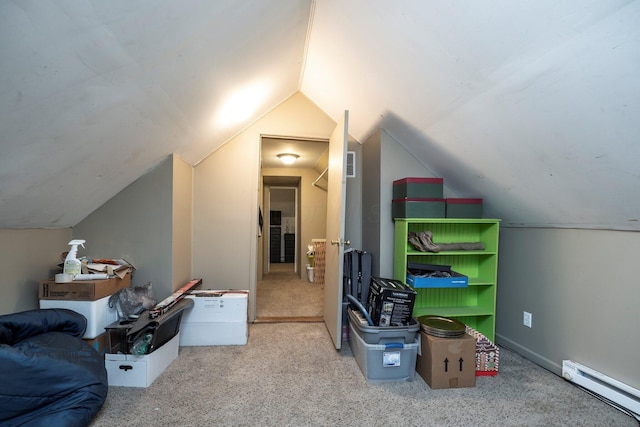 additional living space featuring baseboard heating, lofted ceiling, carpet flooring, and visible vents