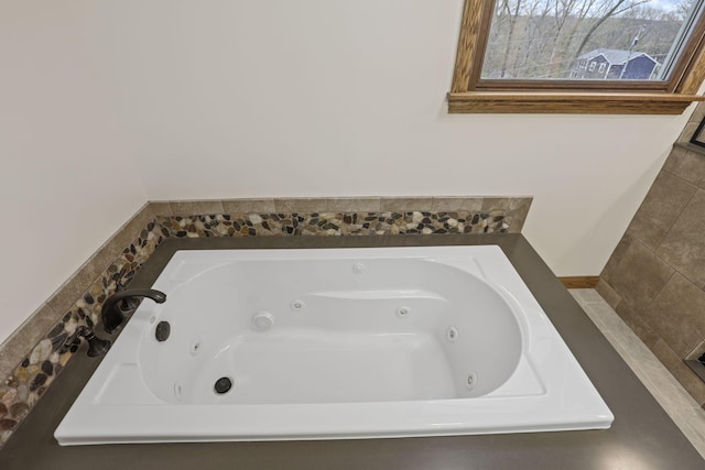 bathroom with a jetted tub