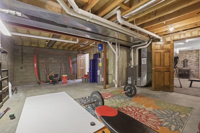 unfinished basement with heating unit and electric water heater