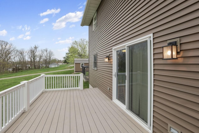 wooden terrace with a yard