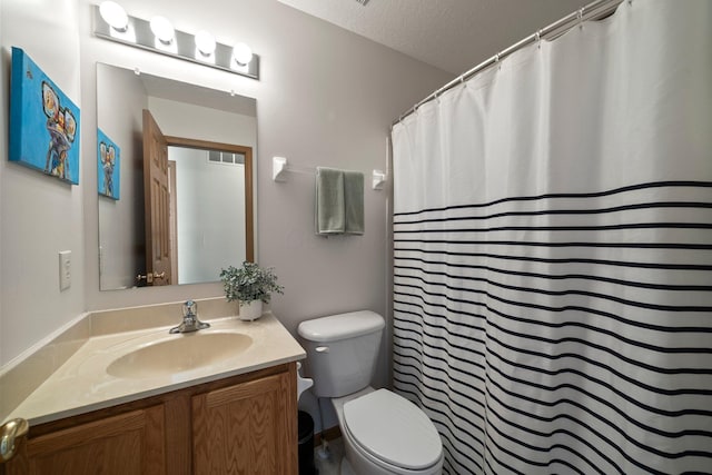 bathroom featuring a textured ceiling, visible vents, vanity, toilet, and a shower with shower curtain