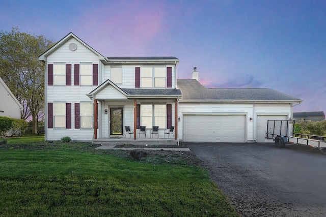 1065 Mastell Dr, Reynoldsburg, OH 43068 - view of front of property featuring driveway, an attached garage, a front yard, a porch, and a chimney