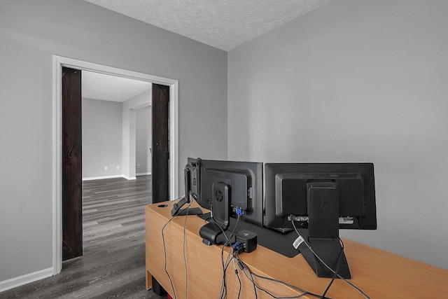 1065 Mastell Dr, Reynoldsburg, OH 43068 - office featuring wood finished floors, baseboards, and a textured ceiling