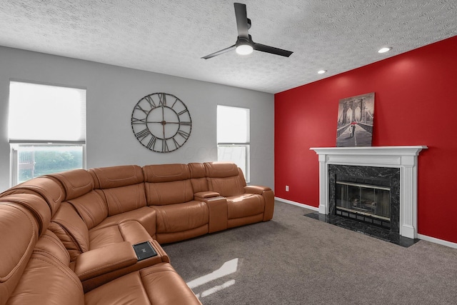 1065 Mastell Dr, Reynoldsburg, OH 43068 - living room with a high end fireplace, a ceiling fan, carpet flooring, plenty of natural light, and a textured ceiling