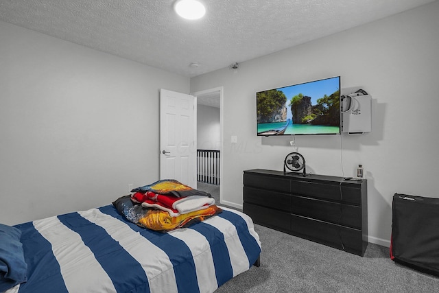 1065 Mastell Dr, Reynoldsburg, OH 43068 - bedroom featuring carpet floors, a textured ceiling, and baseboards