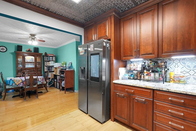 3161 Bowdoin Cir, Columbus, OH 43204 - kitchen featuring stainless steel refrigerator with ice dispenser, light wood-style floors, tasteful backsplash, ornamental molding, and a ceiling fan