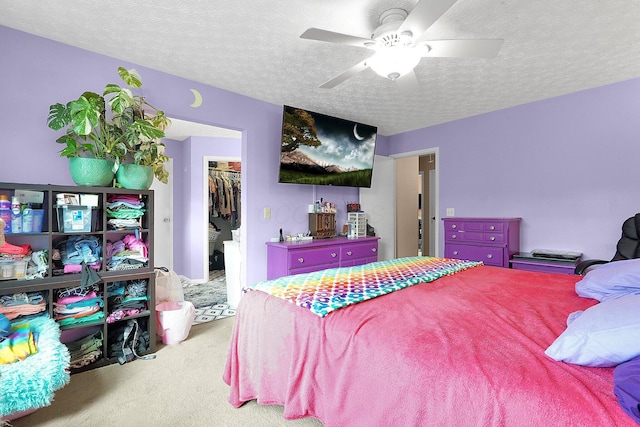 3161 Bowdoin Cir, Columbus, OH 43204 - bedroom with carpet, a walk in closet, a textured ceiling, a closet, and a ceiling fan