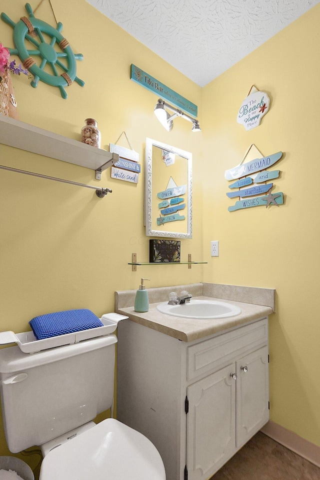 3161 Bowdoin Cir, Columbus, OH 43204 - bathroom with toilet, vanity, and a textured ceiling