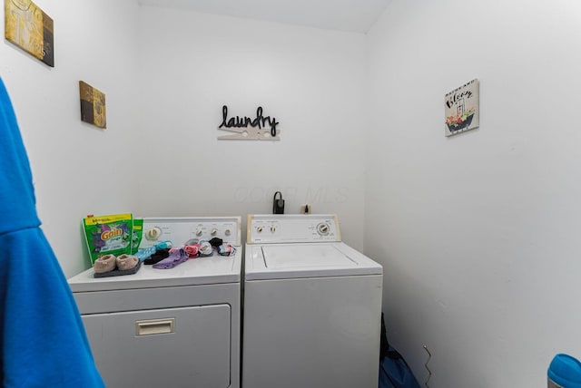 laundry room featuring washer and clothes dryer and laundry area