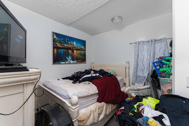 bedroom featuring a textured ceiling