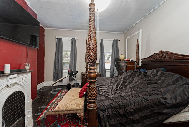 bedroom featuring crown molding, baseboards, and multiple windows