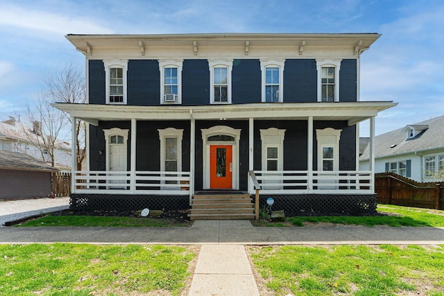 view of front facade with cooling unit, covered porch, and fence