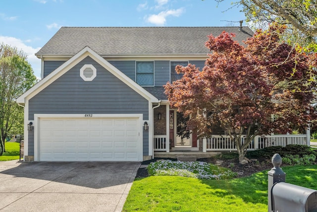 view of front of home featuring a porch, roof with shingles, a garage, a front lawn, and concrete driveway