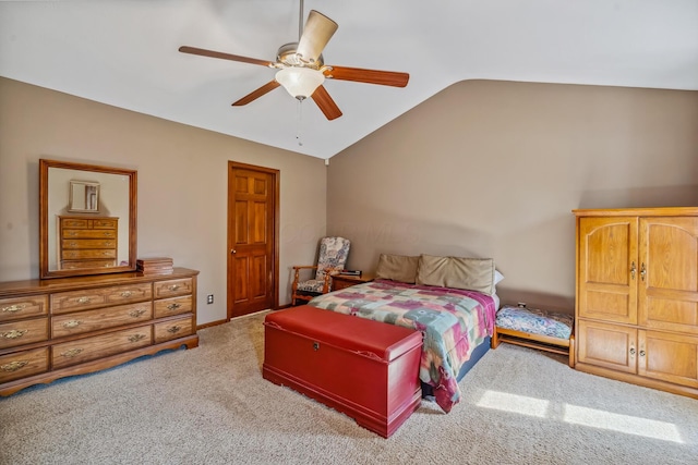 carpeted bedroom with ceiling fan and lofted ceiling