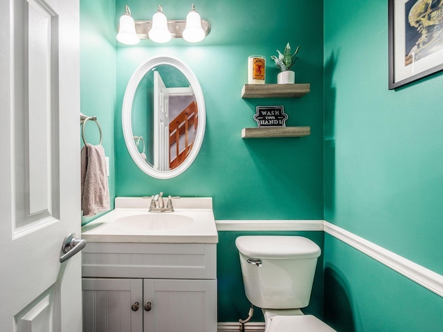 half bath with toilet and vanity
