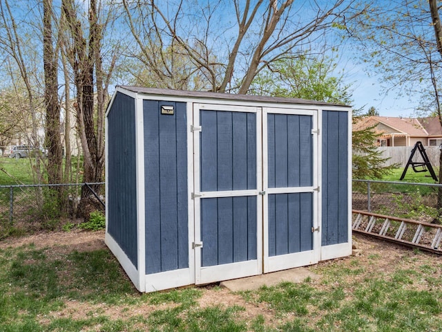 view of shed featuring a fenced backyard