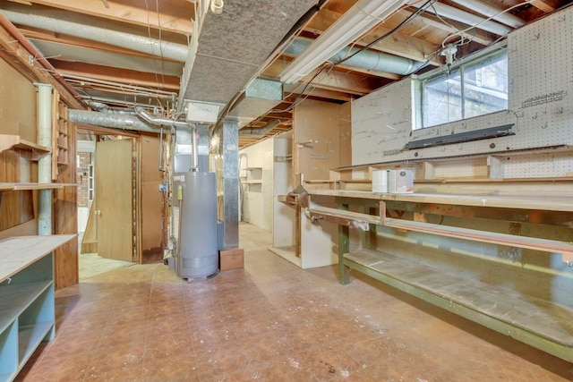 270 Mckinley Ave, New Lexington, OH 43764 - basement with tile patterned floors, a workshop area, and gas water heater