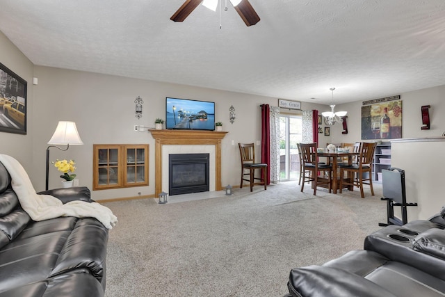 2131 Ripple Rd, Hilliard, OH 43026 - living area featuring carpet floors, a textured ceiling, ceiling fan with notable chandelier, baseboards, and a fireplace with flush hearth