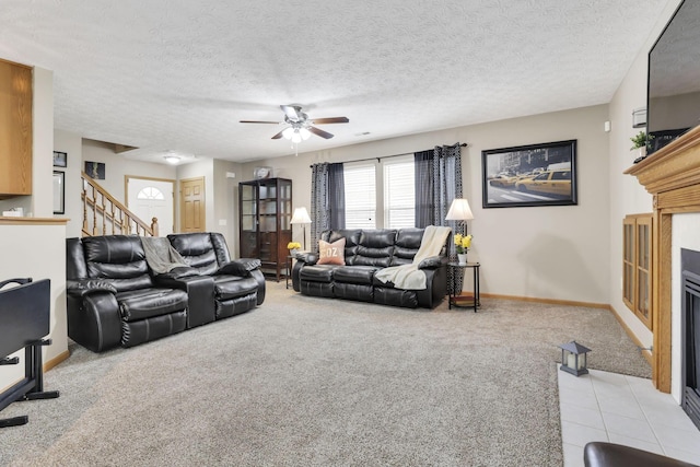 2131 Ripple Rd, Hilliard, OH 43026 - living area with light carpet, baseboards, ceiling fan, stairway, and a tile fireplace