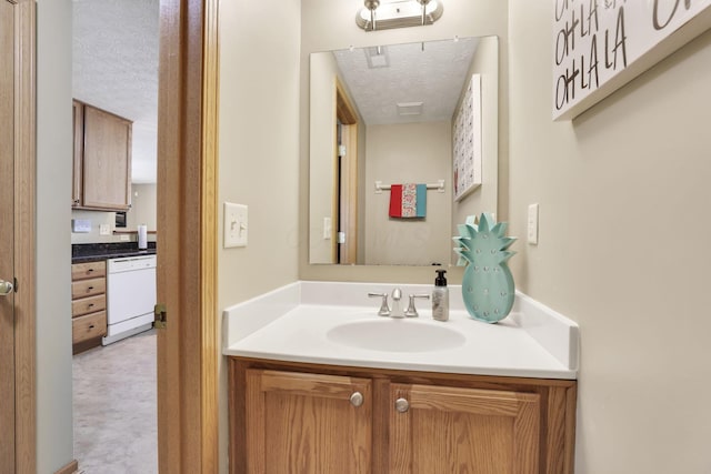 2131 Ripple Rd, Hilliard, OH 43026 - bathroom featuring a textured ceiling and vanity