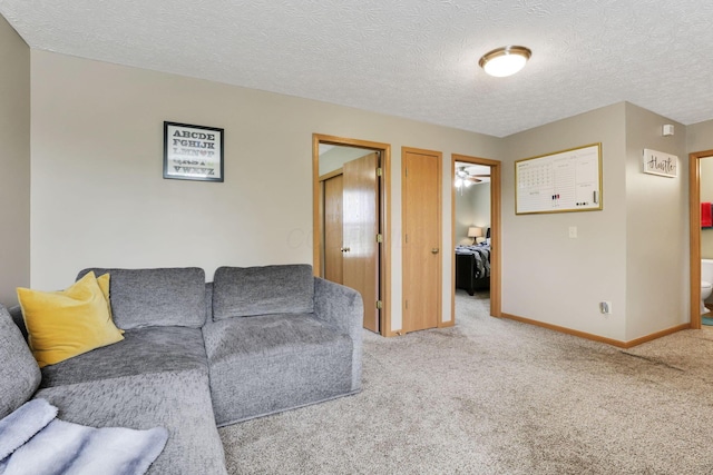 2131 Ripple Rd, Hilliard, OH 43026 - living area with baseboards, carpet, and a textured ceiling