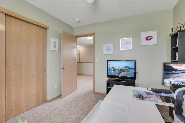2131 Ripple Rd, Hilliard, OH 43026 - carpeted office featuring baseboards and a textured ceiling