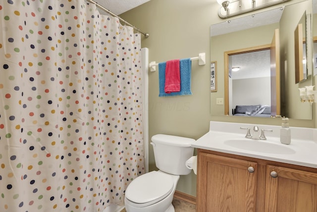 2131 Ripple Rd, Hilliard, OH 43026 - full bath with toilet, a textured ceiling, curtained shower, and vanity
