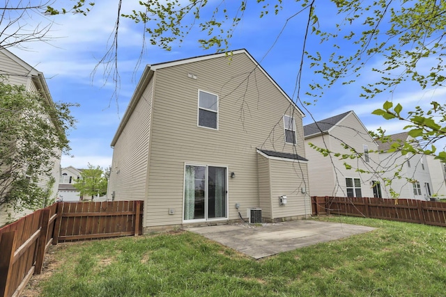 2131 Ripple Rd, Hilliard, OH 43026 - rear view of property with central air condition unit, a patio, a yard, and a fenced backyard