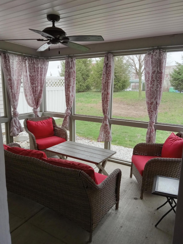 sunroom with a ceiling fan and plenty of natural light