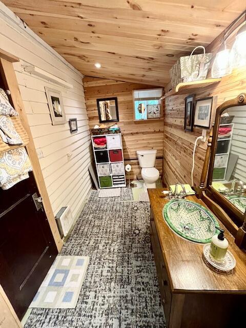 420 Twentyfirst St, Lancaster, OH 43130 - bathroom featuring wooden walls, wood ceiling, toilet, and lofted ceiling