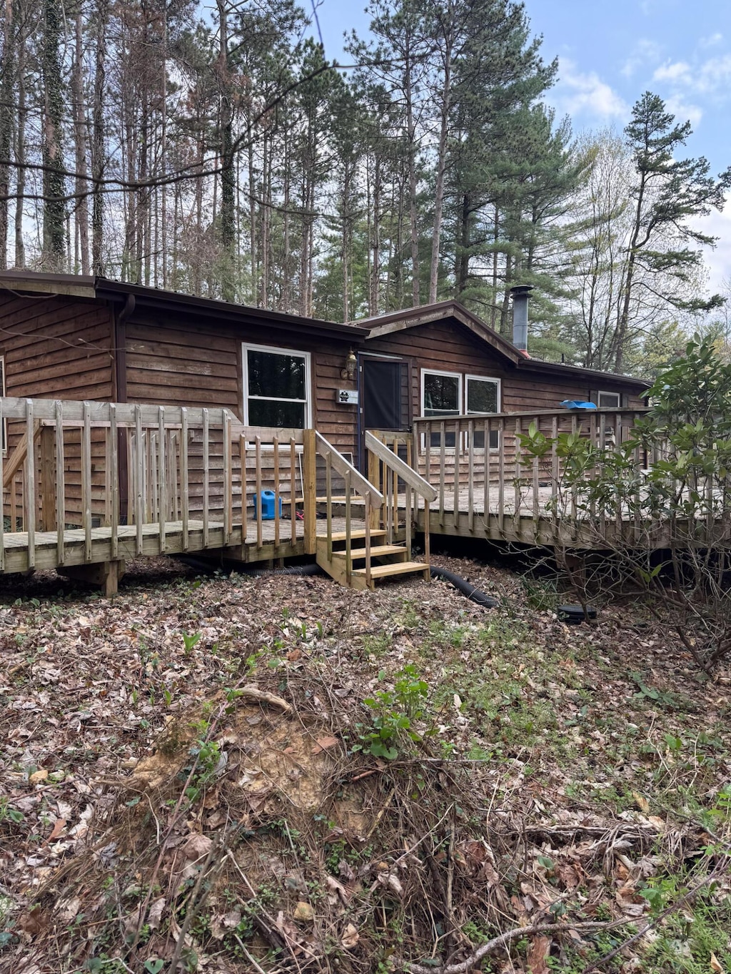 back of property with a deck