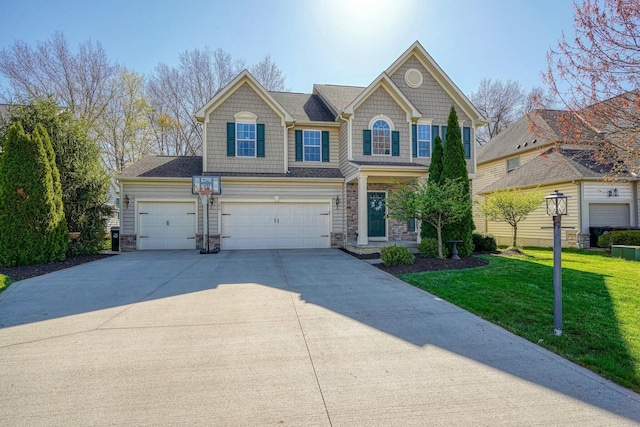 view of front of home with stone siding, an attached garage, a front yard, and concrete driveway