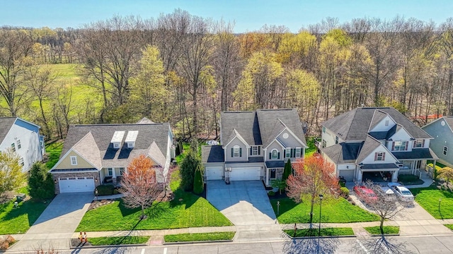 bird's eye view with a forest view and a residential view