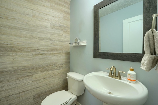 bathroom with toilet and a sink