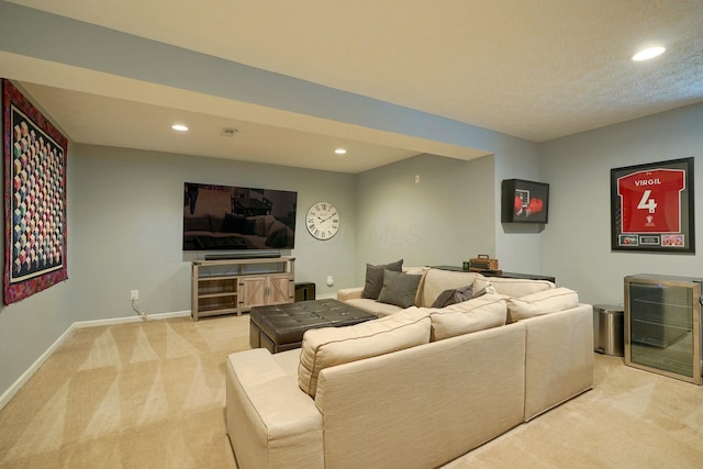 living area with baseboards, light carpet, and recessed lighting