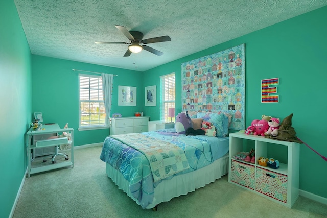 bedroom with carpet flooring, baseboards, and a ceiling fan