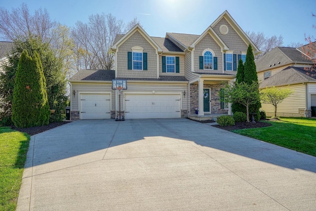 view of front of property featuring stone siding, an attached garage, a front yard, and concrete driveway