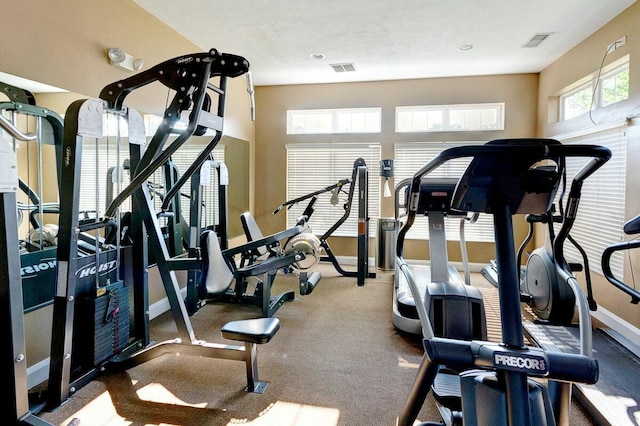 workout area with baseboards and visible vents