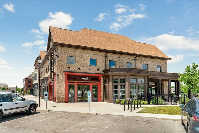 view of building exterior featuring fence