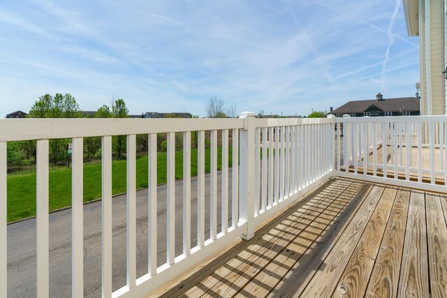 wooden terrace with a yard