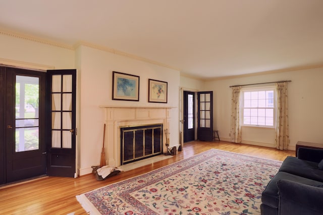 536 E Allen St, Lancaster, OH 43130 - living area featuring baseboards, ornamental molding, a fireplace, and wood finished floors