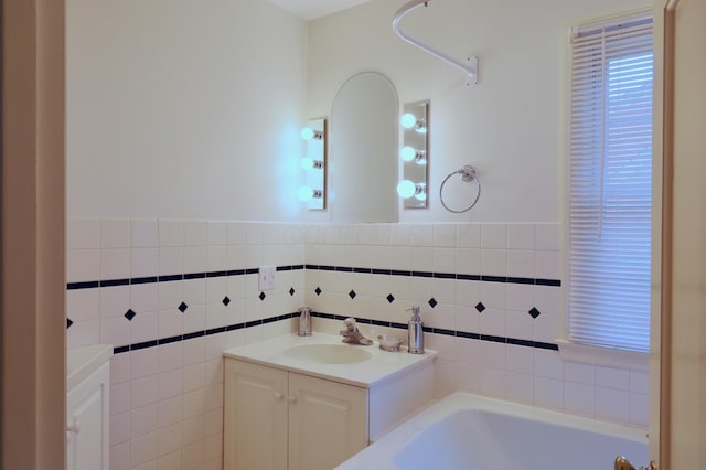 536 E Allen St, Lancaster, OH 43130 - bathroom with wainscoting, vanity, a garden tub, and tile walls